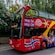 A double decker tour bus with the words ‘Hop On Hop Off’ and ‘City Sightseeing Norway’